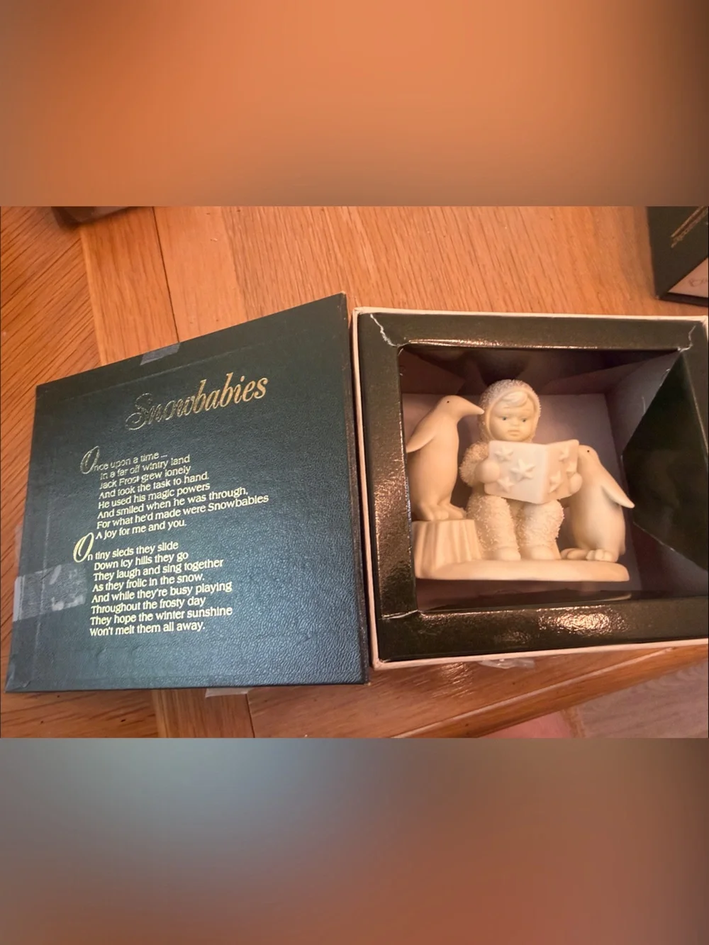 Department 56 Ivory Child Reading Figurine with Penguins “Read Me a Story!”